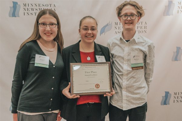 Three students with award