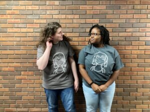 the author and her friend, wearing the shirts she made at Art Club