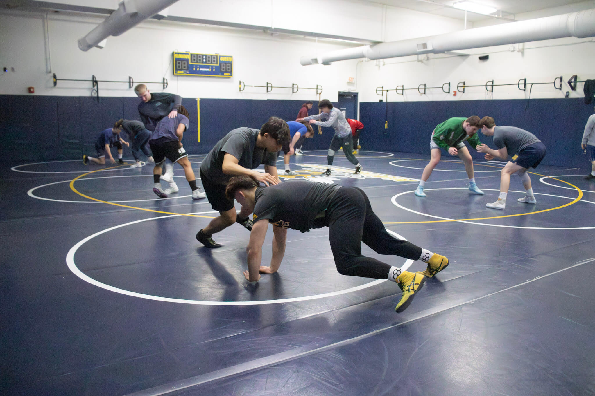 a typical scene in the RCTC mat room, where wrestlers grapple as practice gets into the bulk of the drilling.