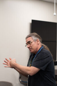 RCTC instructor teaching and using his hands.