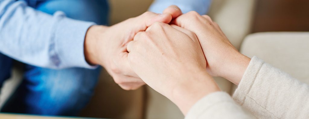 photo of holding hands in support