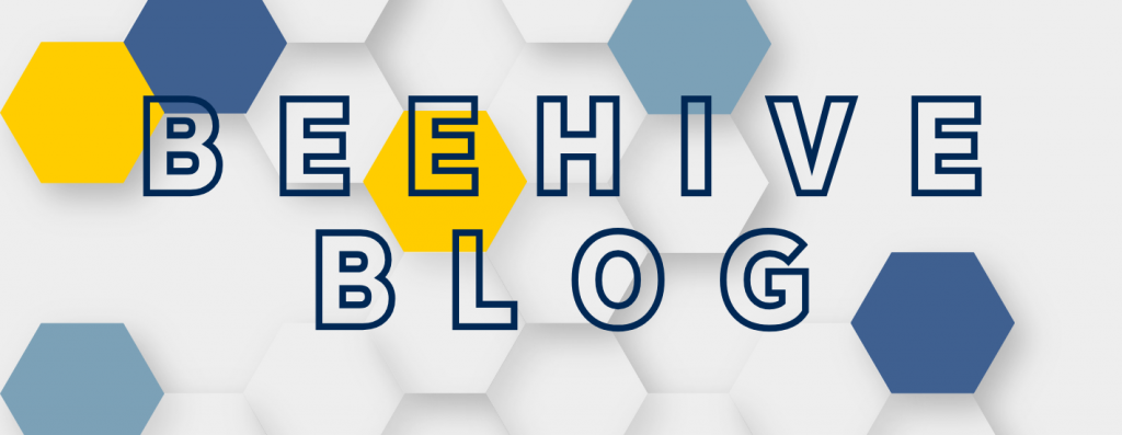 A white honeycomb with two gold cells and four blue cells. "Beehive Blog"